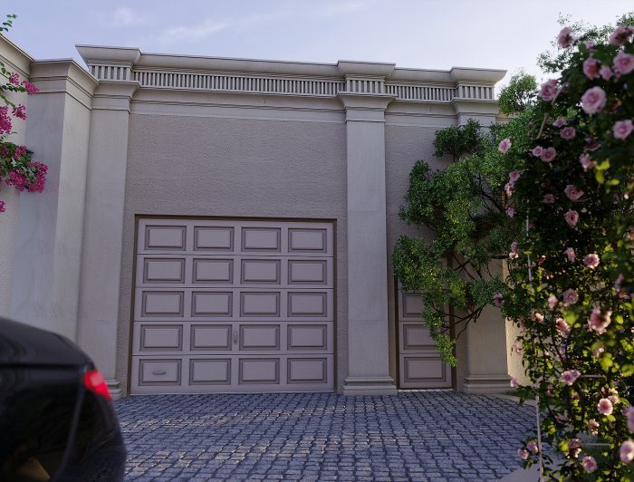 Garage door set in a decorative facade with a paved driveway — Excavation and Basements: Planning and Protection